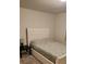 Cozy bedroom with a comfortable bed and a bedside table, creating a relaxing retreat at 4762 Sparkling Shell Ave, Kissimmee, FL 34746