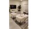 Bright living room with modern furniture, tiled floors and plenty of natural light at 4762 Sparkling Shell Ave, Kissimmee, FL 34746