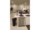 Open floor plan with a kitchen island overlooking the living room area at 4762 Sparkling Shell Ave, Kissimmee, FL 34746