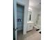 Bright bathroom with a shower-tub combination and shelved linen closet at 5006 Vellacito Way, Davenport, FL 33897