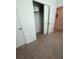 Bedroom closet with sliding doors and shelving for organized storage at 5006 Vellacito Way, Davenport, FL 33897