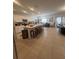 Open concept kitchen featuring a large island with stool seating and modern appliances at 5006 Vellacito Way, Davenport, FL 33897