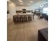 Spacious open kitchen with white cabinetry, large island, and an adjacent dining area at 5006 Vellacito Way, Davenport, FL 33897