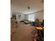 Spacious living room with ample seating, decor, and natural light at 5006 Vellacito Way, Davenport, FL 33897