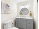 Bathroom features a modern vanity, decorative mirror, and neutral colors with new fixtures at 577 Compton Ct, Deland, FL 32724