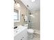 Updated bathroom with glass enclosed shower, modern vanity, updated fixtures, and neutral color palette at 577 Compton Ct, Deland, FL 32724