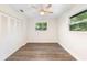 Bright, airy bedroom with wood-look floors, ample closet space, and natural light at 577 Compton Ct, Deland, FL 32724