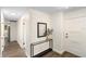 Bright hallway featuring neutral paint, modern console table, and durable flooring at 577 Compton Ct, Deland, FL 32724