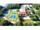 Aerial view showing tennis courts and community pool at 6042 Wade St, Leesburg, FL 34748
