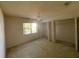 Bright bedroom with a ceiling fan and large window at 6042 Wade St, Leesburg, FL 34748