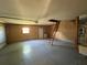 Spacious garage with overhead storage, ample room for vehicles and projects at 6042 Wade St, Leesburg, FL 34748
