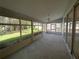 Enjoy the large screened lanai with tile flooring, perfect for relaxing and entertaining guests at 6042 Wade St, Leesburg, FL 34748