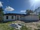 Charming single-story home featuring a modern exterior and an attached two-car garage at 6168 Sw 154Th St, Ocala, FL 34473