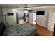 Bedroom features a ceiling fan, bed, and view of the bathroom at 68 S Marbrisa Way, Kissimmee, FL 34743