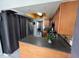 Functional kitchen layout with stainless steel appliances, dark countertops, and wooden cabinetry at 68 S Marbrisa Way, Kissimmee, FL 34743