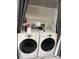 Laundry area features modern washer and dryer units at 68 S Marbrisa Way, Kissimmee, FL 34743