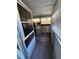 Enclosed porch area with screened windows, offering an outdoor/indoor space at 68 S Marbrisa Way, Kissimmee, FL 34743
