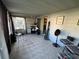 Relaxing sunroom featuring tile flooring, neutral-painted cinderblock, and comfortable seating at 68 S Marbrisa Way, Kissimmee, FL 34743