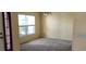 Cozy dining room with carpeted floors, a large window, and neutral paint colors at 697 Winding Lake Dr, Clermont, FL 34711
