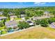 Aerial view of the home showcasing the solar panels and proximity to the water at 721 Lake Cove Pointe Cir, Winter Garden, FL 34787