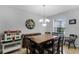 Inviting dining area with tile floors and a view of the front yard at 721 Lake Cove Pointe Cir, Winter Garden, FL 34787