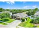 Beautiful single-story home with well-kept lawn, three-car garage, and mature trees at 721 Lake Cove Pointe Cir, Winter Garden, FL 34787