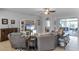 This cozy living room features a large TV and an open floor plan at 721 Lake Cove Pointe Cir, Winter Garden, FL 34787
