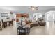 This spacious living room features an open floor plan and access to the kitchen at 721 Lake Cove Pointe Cir, Winter Garden, FL 34787