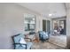 Covered patio with ceiling fan, view of living area, and comfortable seating with blue accent pillows at 721 Lake Cove Pointe Cir, Winter Garden, FL 34787