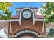 Architectural detail of the town clock with a brick facade and the Winter Garden inscription at 721 Lake Cove Pointe Cir, Winter Garden, FL 34787