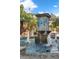 Charming community water fountain with blue mosaic tiles, tiered basins and clear, refreshing water at 721 Lake Cove Pointe Cir, Winter Garden, FL 34787