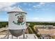 The Winter Garden water tower featuring its beautiful mural against a lovely sky at 721 Lake Cove Pointe Cir, Winter Garden, FL 34787