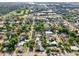 Aerial view features quaint neighborhood with lush green canopy and well-kept homes at 730 W Swoope Ave, Winter Park, FL 32789