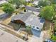An aerial shot of the property displaying roof details, fenced yard, and the updated driveway leading to the street at 730 W Swoope Ave, Winter Park, FL 32789