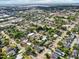 Overhead neighborhood shot featuring tranquil streets, well-maintained homes, and mature landscaping at 730 W Swoope Ave, Winter Park, FL 32789