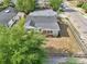 Birds-eye view of the property showcasing the roof, surrounding greenery, and proximity to the street at 730 W Swoope Ave, Winter Park, FL 32789