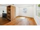 Bright bedroom featuring hardwood floors, white walls, built-in shelves and natural lighting at 730 W Swoope Ave, Winter Park, FL 32789
