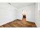 Bedroom with hardwood floors, white walls, closet, and adjacent bathroom at 730 W Swoope Ave, Winter Park, FL 32789
