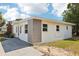 Exterior view of the back of the house with nice green grass at 730 W Swoope Ave, Winter Park, FL 32789