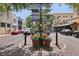 Scenic intersection with flower-filled planters, directional signage, and historic buildings in a vibrant neighborhood at 730 W Swoope Ave, Winter Park, FL 32789