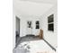Covered outdoor patio with a white ceiling, a small window, and a single door with a glass window at 730 W Swoope Ave, Winter Park, FL 32789