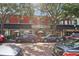 Charming storefronts featuring upscale shops, elegant architecture, and inviting entrances lined with trees at 730 W Swoope Ave, Winter Park, FL 32789