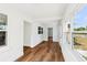 Sun room features wood-look floors, white walls, white trim, and lots of windows with natural light at 730 W Swoope Ave, Winter Park, FL 32789