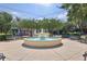 Charming town square with a central fountain, benches, and a vibrant atmosphere surrounded by shops and trees at 730 W Swoope Ave, Winter Park, FL 32789