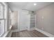 Bedroom with hardwood floors, one window, and a built-in bookshelf at 821 E Lemon Ave, Eustis, FL 32726