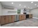 Updated kitchen featuring stainless steel appliances, custom cabinets, and quartz countertops at 821 E Lemon Ave, Eustis, FL 32726