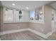 Bright room with natural light from large windows and wood-look flooring at 821 E Lemon Ave, Eustis, FL 32726