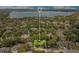 An aerial view that highlights the property location within a neighborhood, near a serene lake at 8316 Granada Blvd, Orlando, FL 32836