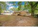 Spacious backyard with patio, grill and mature trees for shade at 8316 Granada Blvd, Orlando, FL 32836