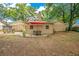 Backyard with lots of seating, patio and mature trees for shade at 8316 Granada Blvd, Orlando, FL 32836